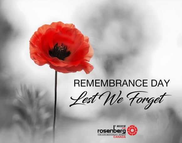 Image of a red poppy flower against a soft, blurred gray background, with the words 'Remembrance Day' and 'Lest We Forget' in elegant script. Rosenberg Canada logo appears at the bottom. This image honors those who served and sacrificed.